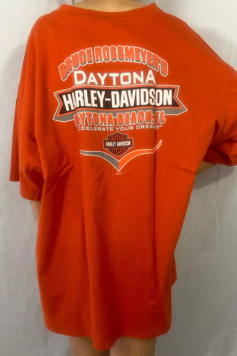 Bruce Rossmeyer's Daytona Harley-Davidson Daytona Beach, FL "Accelerate your dreams" Harley-Davidson Motorcycles Text on back of Orange Tee